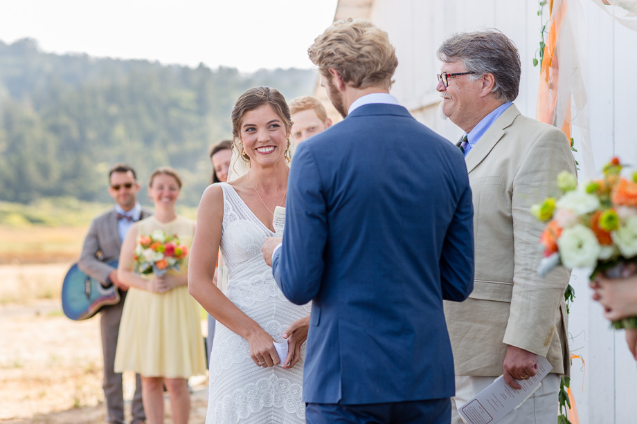 groom reading his wedding vows